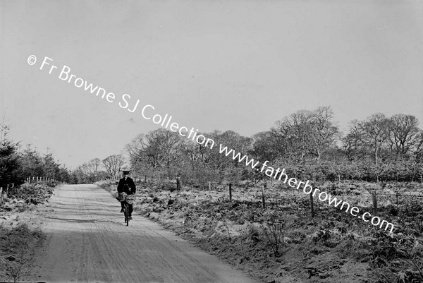 SNOW SCENE  KIERAN RIGNEY POSTMAN ON BICYCLE